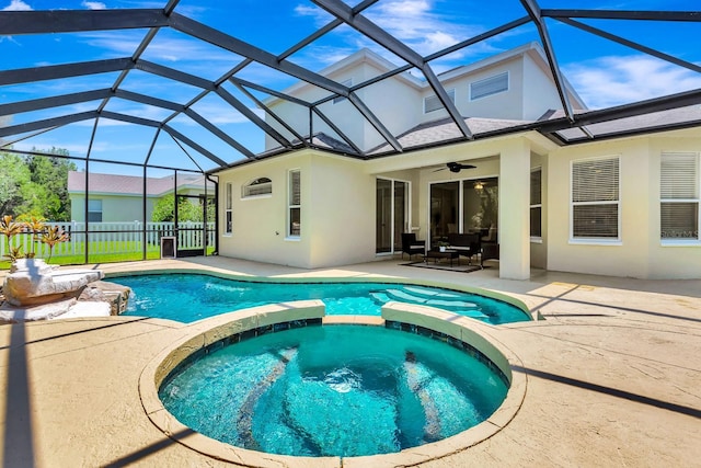 6364 Golden Eye Gln, Lakewood Ranch, FL 34202 - view of swimming pool featuring a pool with connected hot tub, a patio, ceiling fan, and glass enclosure