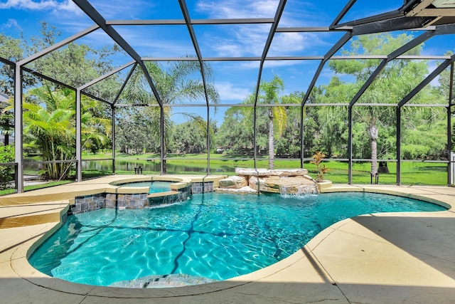 6364 Golden Eye Gln, Lakewood Ranch, FL 34202 - view of pool featuring view of scattered trees, a patio, a pool with connected hot tub, and a lanai