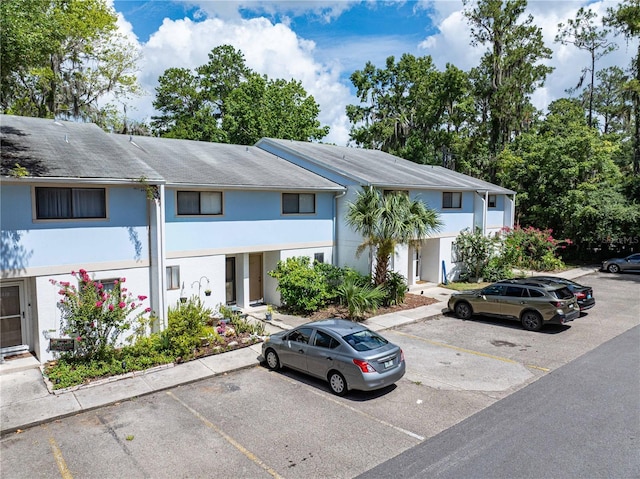 1452 SW 25th Pl Unit D4, Gainesville, FL 32608 - multi unit property with stucco siding and uncovered parking