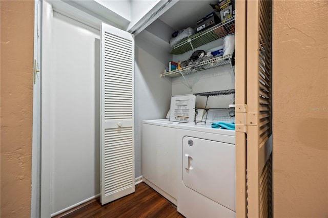 1452 SW 25th Pl Unit D4, Gainesville, FL 32608 - laundry room with washer and dryer and dark wood finished floors
