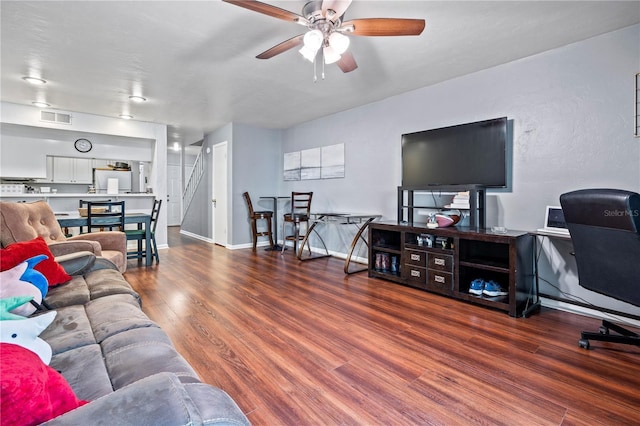 1452 SW 25th Pl Unit D4, Gainesville, FL 32608 - living area with ceiling fan, stairs, and wood finished floors