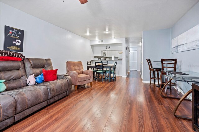 1452 SW 25th Pl Unit D4, Gainesville, FL 32608 - living room featuring wood finished floors and ceiling fan