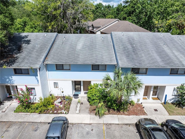 1452 SW 25th Pl Unit D4, Gainesville, FL 32608 - view of front facade with stucco siding and uncovered parking