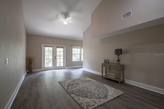 9177 SW 52nd Rd Unit E302, Gainesville, FL 32608 - unfurnished living room featuring a ceiling fan, dark wood-style flooring, french doors, and high vaulted ceiling