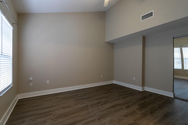 9177 SW 52nd Rd Unit E302, Gainesville, FL 32608 - unfurnished room featuring dark wood finished floors and ceiling fan