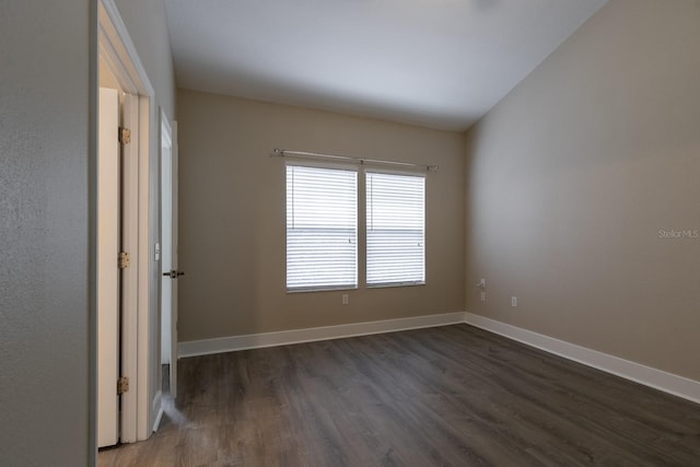9177 SW 52nd Rd Unit E302, Gainesville, FL 32608 - empty room featuring dark wood-type flooring and baseboards