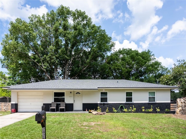 2826 NE 18th Ct, Ocala, FL 34470 - view of front of house featuring concrete driveway, a garage, stucco siding, and brick siding