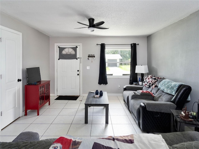 2826 NE 18th Ct, Ocala, FL 34470 - living area with ceiling fan, light tile patterned floors, and a textured ceiling