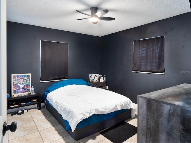 2826 NE 18th Ct, Ocala, FL 34470 - tiled bedroom featuring a textured ceiling and ceiling fan
