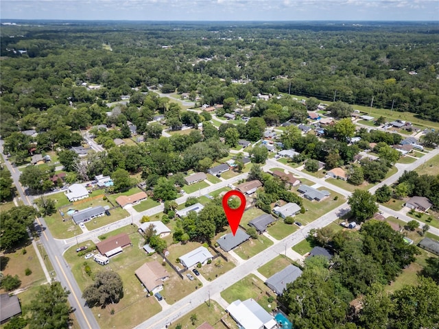 2826 NE 18th Ct, Ocala, FL 34470 - aerial perspective of suburban area with a heavily wooded area