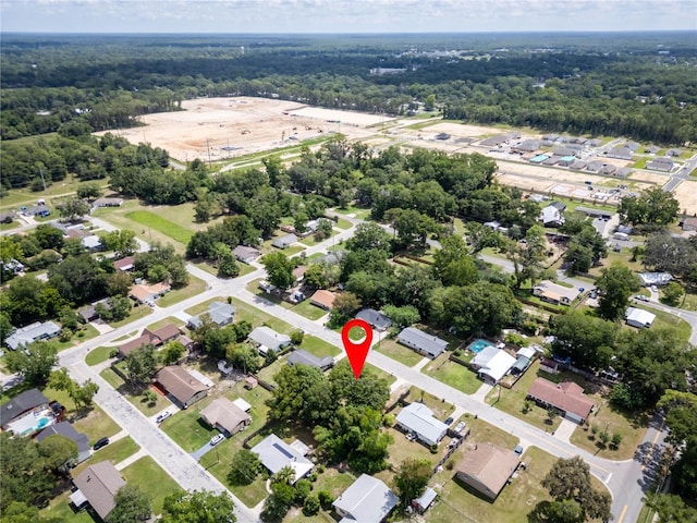 2826 NE 18th Ct, Ocala, FL 34470 - aerial view of property's location featuring a heavily wooded area and nearby suburban area