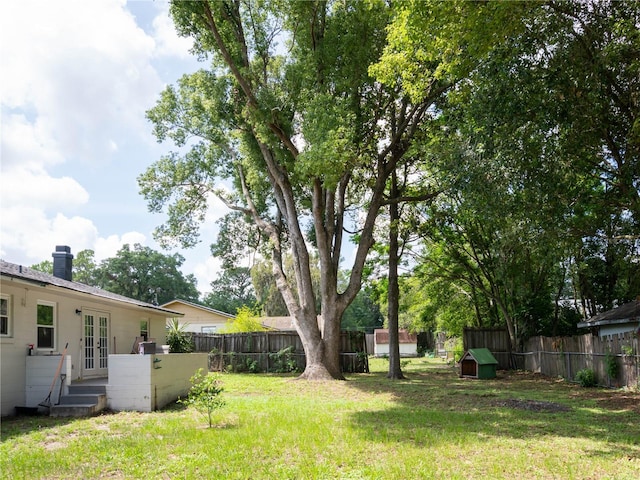 2826 NE 18th Ct, Ocala, FL 34470 - fenced backyard with french doors
