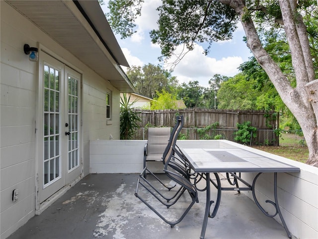 2826 NE 18th Ct, Ocala, FL 34470 - view of patio featuring french doors and outdoor dining area