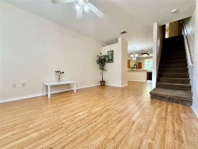 3901 SW 20th Ave Unit 611, Gainesville, FL 32607 - unfurnished living room featuring light wood finished floors, a ceiling fan, and stairway