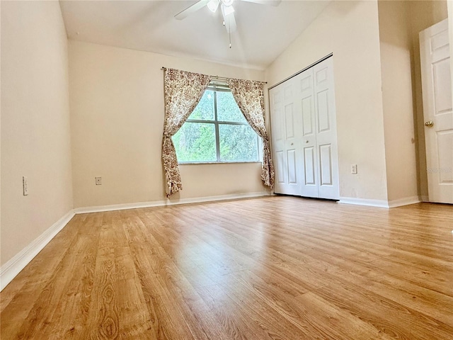 3901 SW 20th Ave Unit 611, Gainesville, FL 32607 - unfurnished bedroom with light wood finished floors, a closet, and a ceiling fan