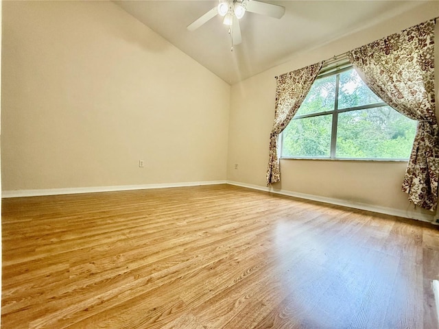 3901 SW 20th Ave Unit 611, Gainesville, FL 32607 - empty room with wood finished floors, vaulted ceiling, and a ceiling fan
