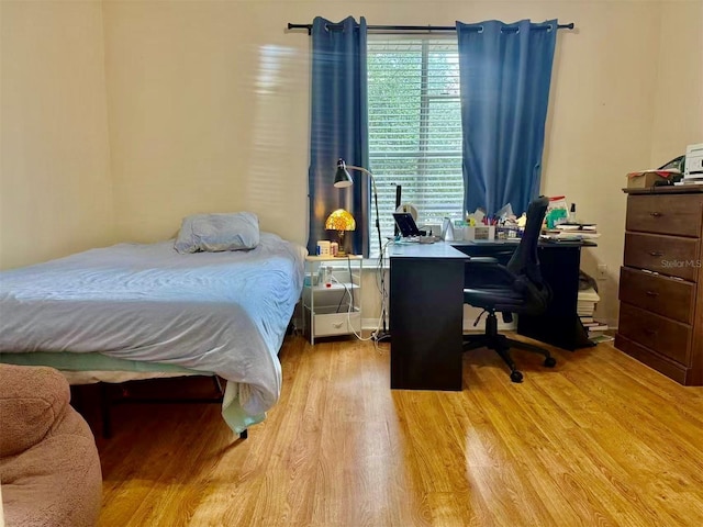 3901 SW 20th Ave Unit 611, Gainesville, FL 32607 - bedroom with wood finished floors and an office area