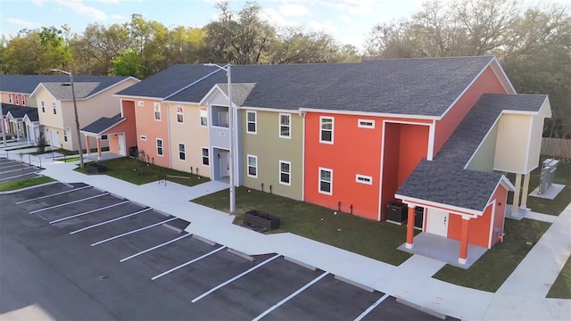 1581 NW 29th Rd Unit 4, Gainesville, FL 32605 - view of property with uncovered parking