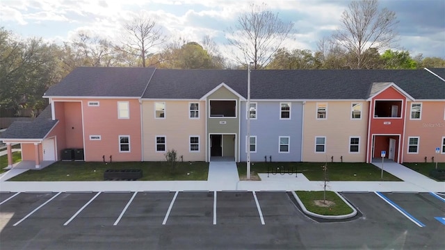 1581 NW 29th Rd Unit 4, Gainesville, FL 32605 - view of property with uncovered parking