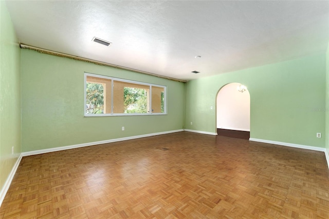 4700 NW 19th Pl, Gainesville, FL 32605 - empty room with baseboards and arched walkways