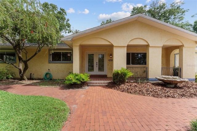 4700 NW 19th Pl, Gainesville, FL 32605 - view of front of property featuring stucco siding and french doors