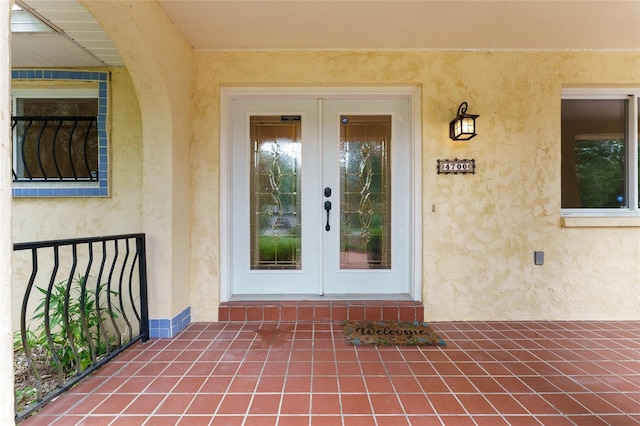 4700 NW 19th Pl, Gainesville, FL 32605 - doorway to property with french doors and stucco siding