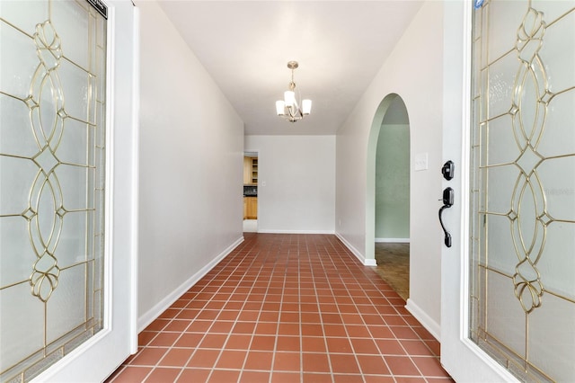 4700 NW 19th Pl, Gainesville, FL 32605 - foyer entrance featuring arched walkways and a chandelier