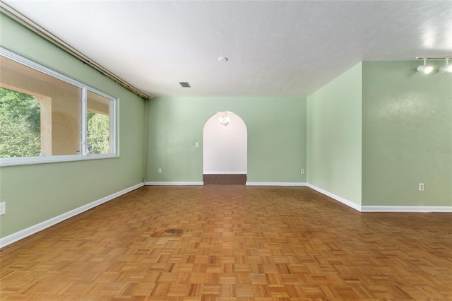 4700 NW 19th Pl, Gainesville, FL 32605 - spare room with baseboards and arched walkways