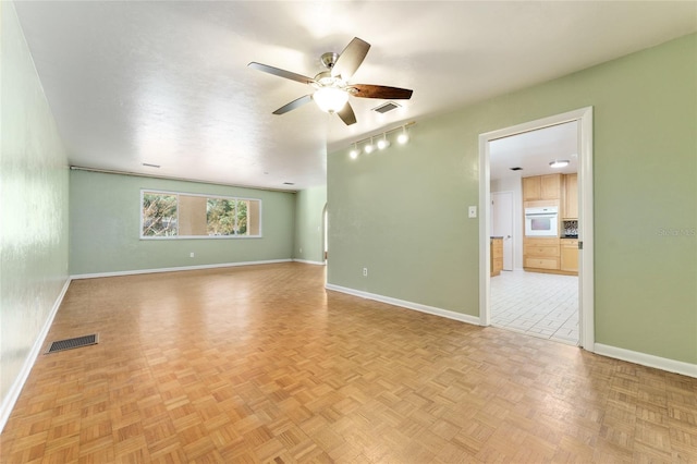 4700 NW 19th Pl, Gainesville, FL 32605 - spare room with a ceiling fan and baseboards