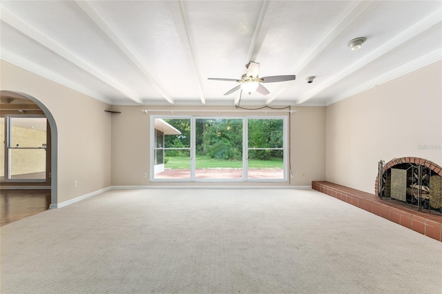 4700 NW 19th Pl, Gainesville, FL 32605 - unfurnished living room featuring carpet floors, arched walkways, ceiling fan, and beam ceiling