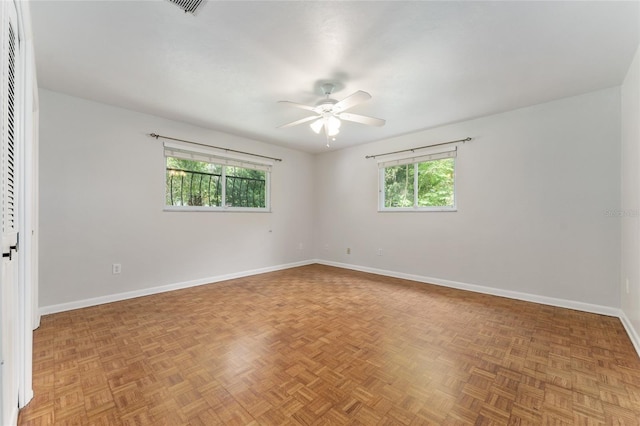 4700 NW 19th Pl, Gainesville, FL 32605 - unfurnished room with baseboards and ceiling fan
