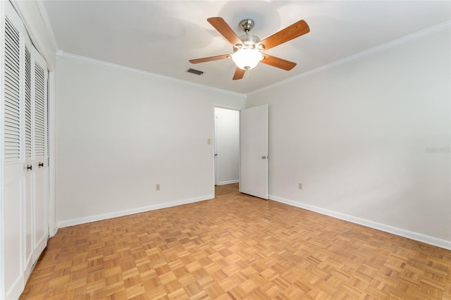 4700 NW 19th Pl, Gainesville, FL 32605 - unfurnished bedroom with crown molding, a closet, and ceiling fan