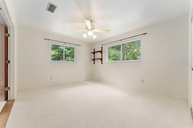 4700 NW 19th Pl, Gainesville, FL 32605 - carpeted empty room with ceiling fan and plenty of natural light