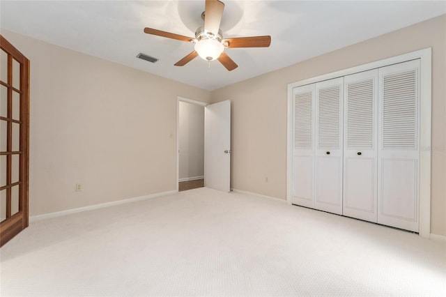 4700 NW 19th Pl, Gainesville, FL 32605 - unfurnished bedroom with light carpet, a closet, and a ceiling fan