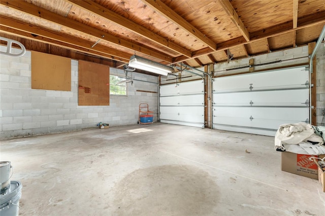 4700 NW 19th Pl, Gainesville, FL 32605 - garage with concrete block wall and a garage door opener