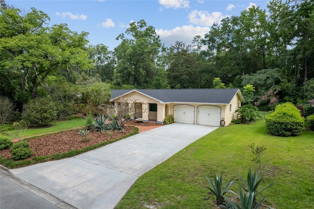 4700 NW 19th Pl, Gainesville, FL 32605 - ranch-style home with an attached garage, concrete driveway, a front yard, and stucco siding