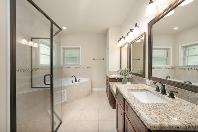 6316 SW 50th St, Gainesville, FL 32608 - bathroom with vanity, a garden tub, tile patterned flooring, a shower stall, and recessed lighting