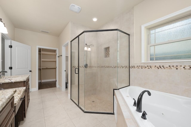 6316 SW 50th St, Gainesville, FL 32608 - bathroom featuring vanity, a shower stall, a jetted tub, and tile patterned floors