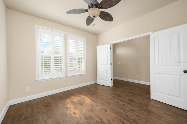 6316 SW 50th St, Gainesville, FL 32608 - unfurnished bedroom featuring dark wood finished floors and a ceiling fan