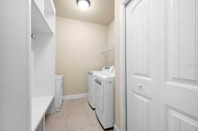 6316 SW 50th St, Gainesville, FL 32608 - laundry area featuring washer and clothes dryer and light tile patterned floors