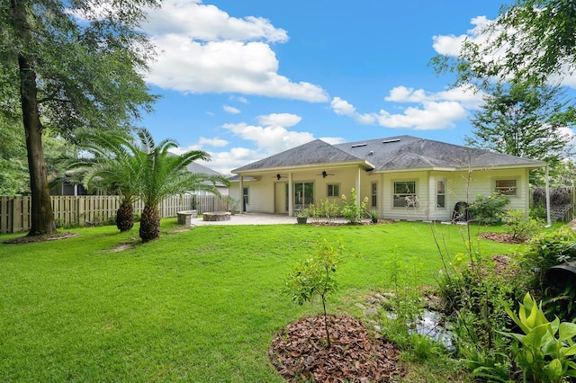6316 SW 50th St, Gainesville, FL 32608 - back of property with a ceiling fan, a fire pit, a patio, and a fenced backyard