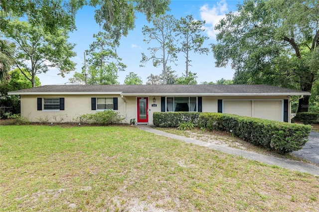 3331 NW 30th Ave, Gainesville, FL 32605 - single story home with an attached garage and a front lawn