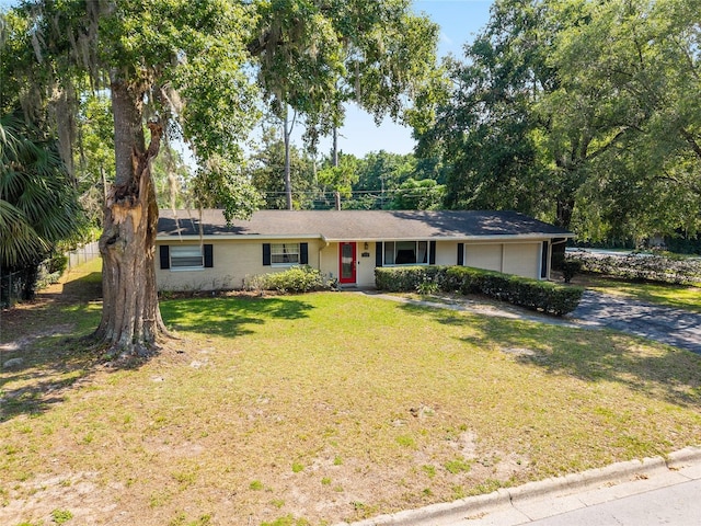3331 NW 30th Ave, Gainesville, FL 32605 - single story home with driveway and a front lawn