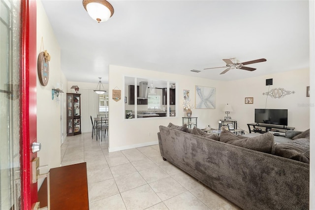 3331 NW 30th Ave, Gainesville, FL 32605 - living room featuring a ceiling fan and light tile patterned floors