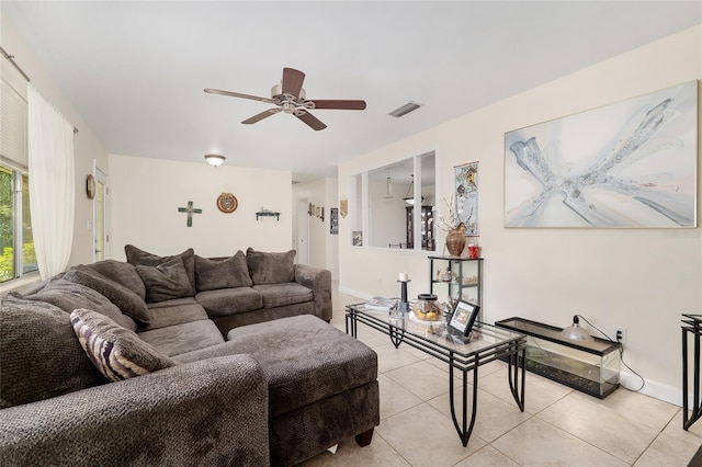 3331 NW 30th Ave, Gainesville, FL 32605 - living room with ceiling fan and light tile patterned flooring