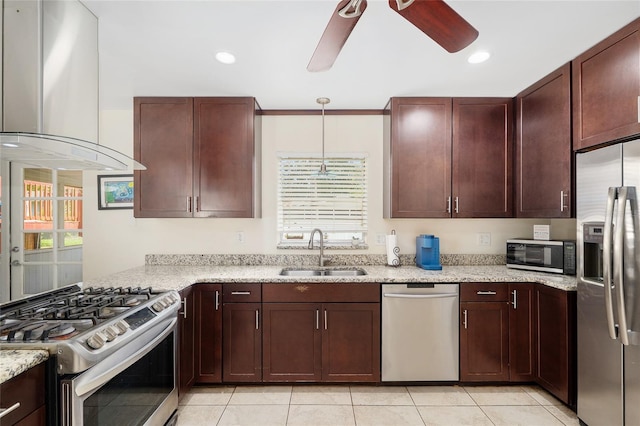 3331 NW 30th Ave, Gainesville, FL 32605 - kitchen with appliances with stainless steel finishes, premium range hood, a ceiling fan, light stone countertops, and recessed lighting