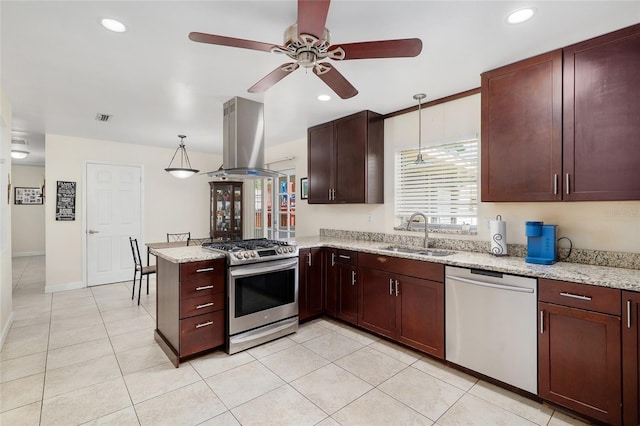 3331 NW 30th Ave, Gainesville, FL 32605 - kitchen with appliances with stainless steel finishes, island range hood, ceiling fan, a peninsula, and pendant lighting