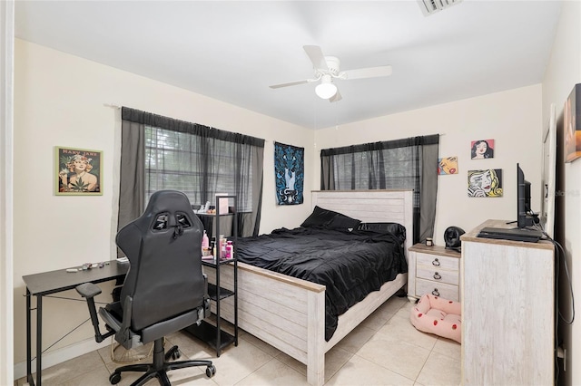 3331 NW 30th Ave, Gainesville, FL 32605 - bedroom with tile patterned flooring, ceiling fan, and an office area