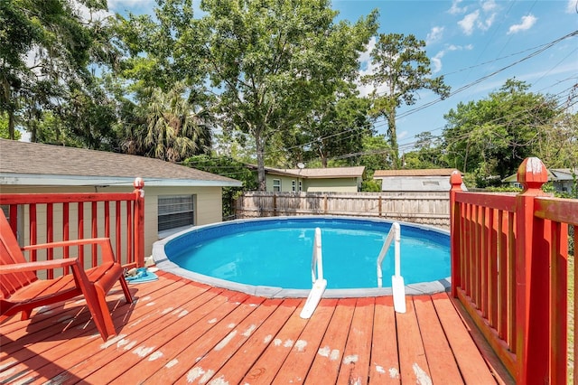 3331 NW 30th Ave, Gainesville, FL 32605 - view of swimming pool featuring a deck and a fenced backyard