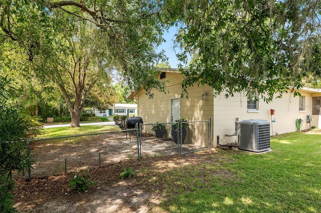 3331 NW 30th Ave, Gainesville, FL 32605 - view of property exterior with a central AC unit and a gate